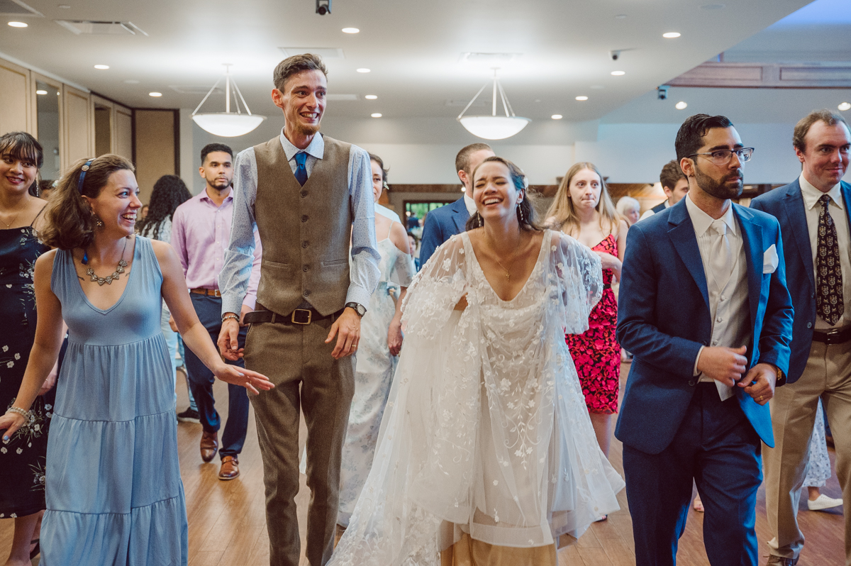 These two dancers, passionate lovers got married on a hot humid day at Auletto Caterers in Deptford NJ. Even though it was hot & humid Nina and Hector were all smiles as well as their family during the family portrait time. Wedding couple's and families that listens to you and does everything you ask them to even though the weather and environment can be tough are the BEST kind of clients! Nina and Hector were that best ideal clients, they from day one left all control regarding photo to me, did not question or have concerns. Knowing that you have this full trust and control on the wedding day makes you want to give your 100% and more. Nina and Hector are one of my top ideal clients and their wedding day photos are living proof of it. Nina and Hector's wedding day was combined of casual, mess, chaos, laughters, chill, emotional and passionate love for dancing. This was my first time at Auletto Caterers and in this part of NJ and this wedding venue in Deptford NJ was a pleasant surprise. It was full of secret locations for photos, garden, little pond where I played around with reflections, peacocks, waterfall and lavender field! Plus kind people to work with. Nina and Hector's July wedding at Auletto Caterers NJ captured by Karis from Hey Karis NY, NJ, Brooklyn, Hudson Valley and Catskills Wedding and Elopement Photographer.